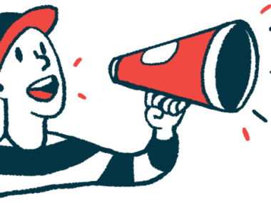 A person in a baseball cap speaks through a megaphone.